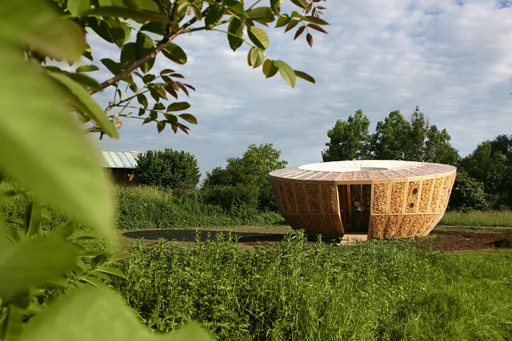 Architectural firm St André-Lang has designed and built a compact circular housing prototype that incorporates corn cobs within the walls
