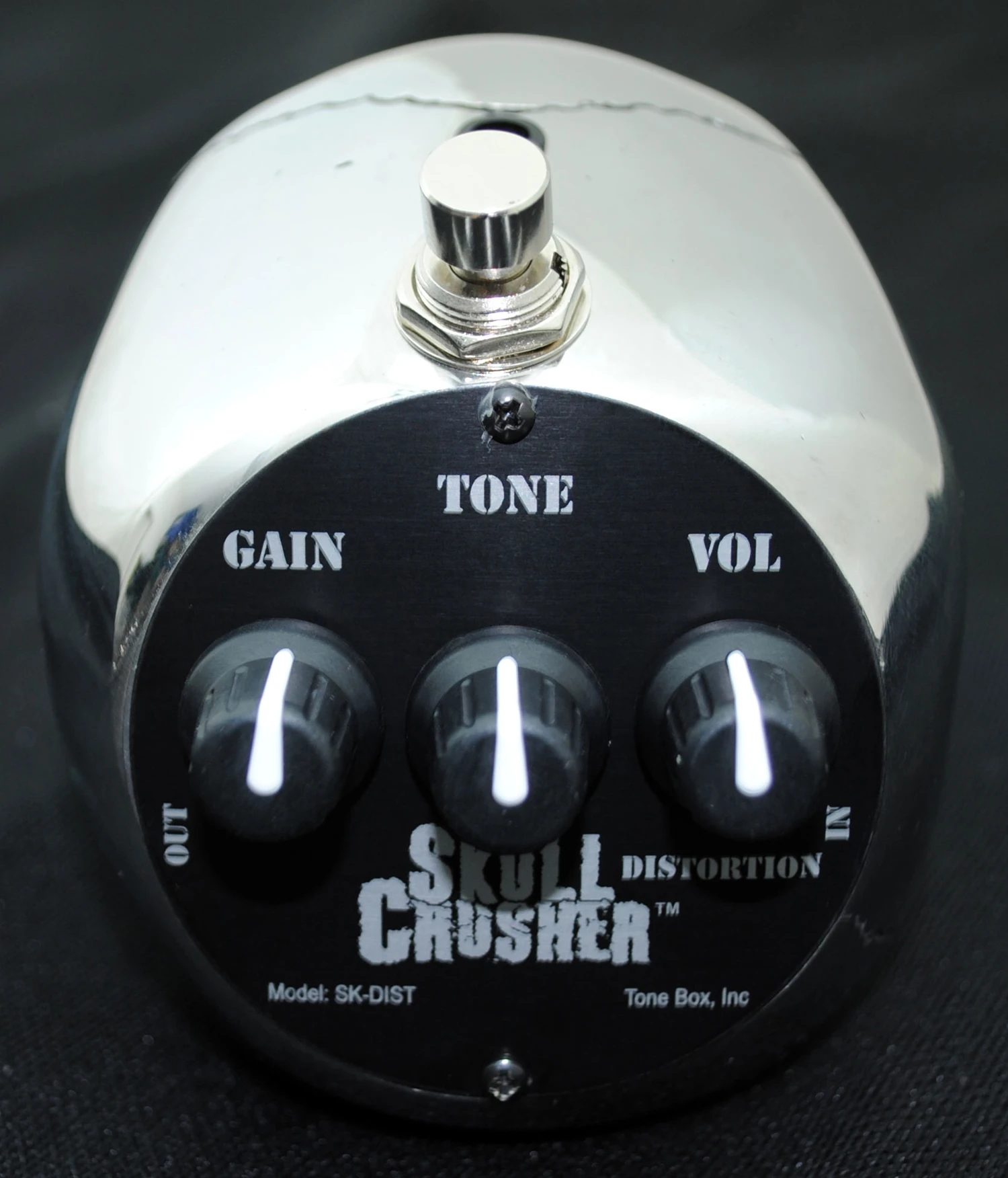 Who wouldn't want a polished stainless steel rear? The new Skull Crusher's footswitch sits on top of the head, behind a blue LED