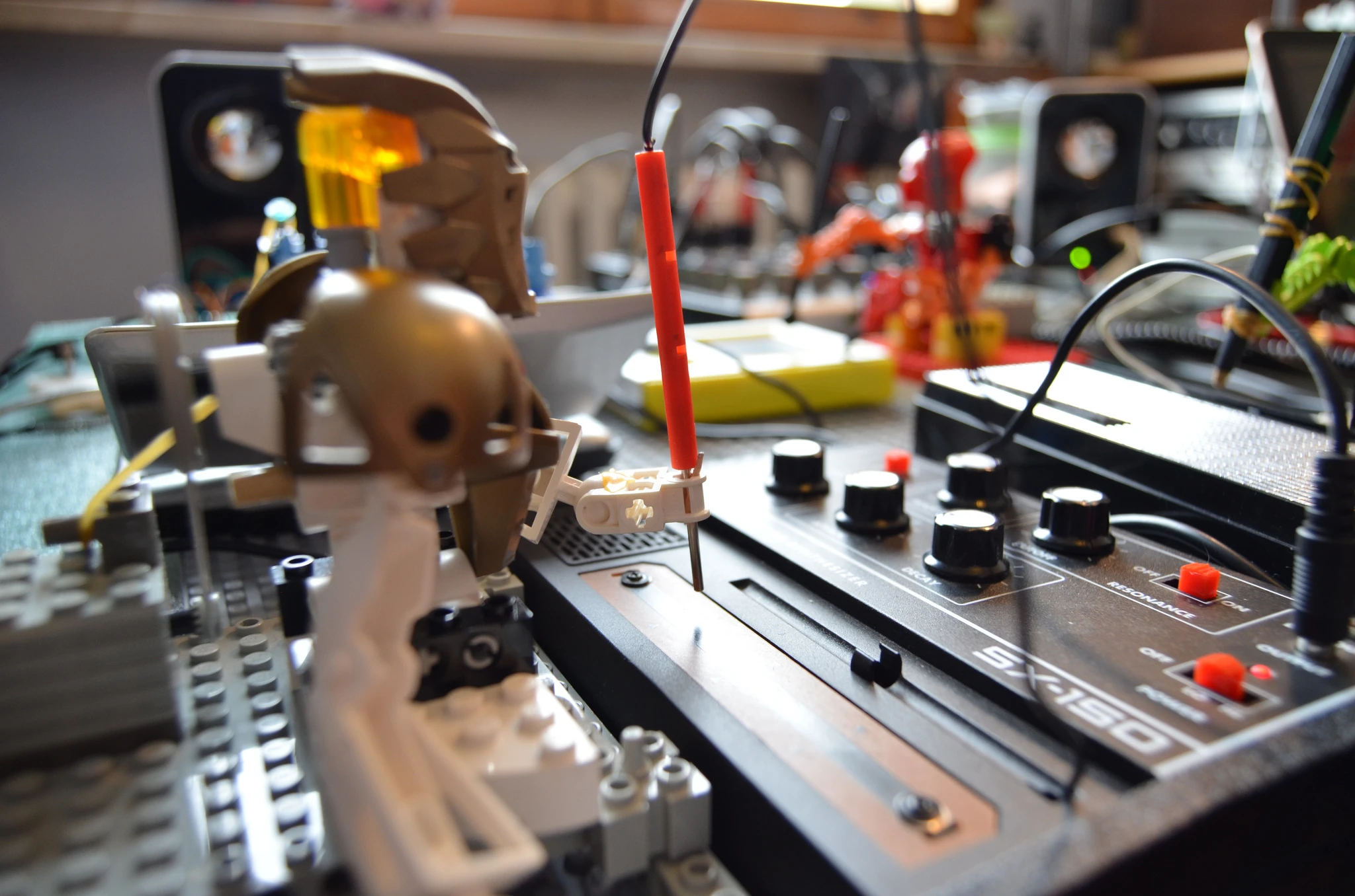 The tiny bots essentially perform a MIDI sequence by hitting the instrument they're facing when prompted