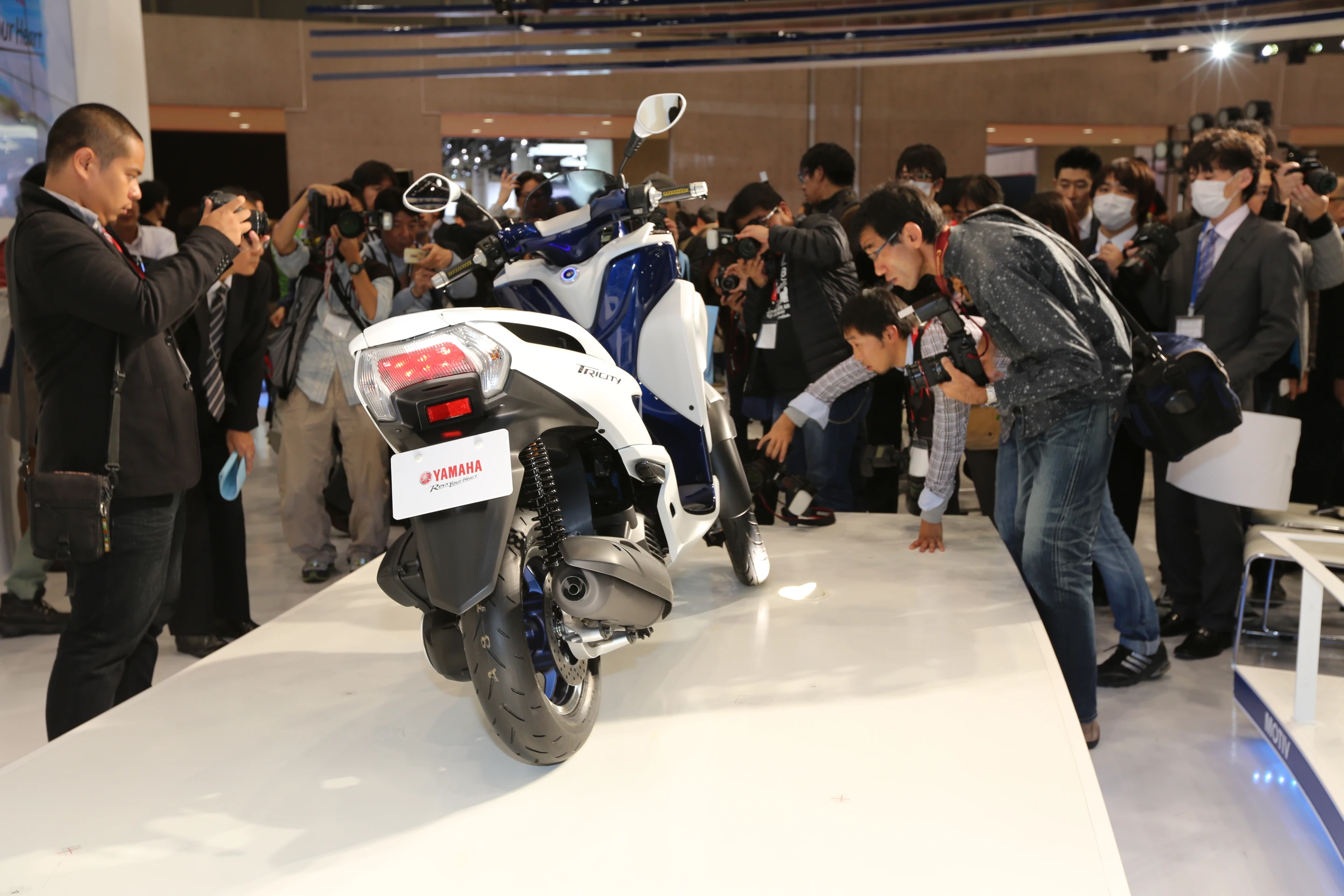 The Tricity has a single disc brake to the rear, and a compartment under the seat that's big enough to stow away a full-size helmet