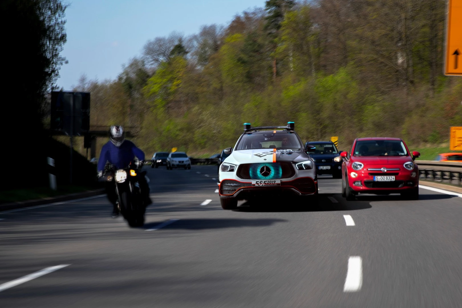Visible cues on the car's grille signal to other drivers when the ESF 2019 is making room for them to merge in traffic
