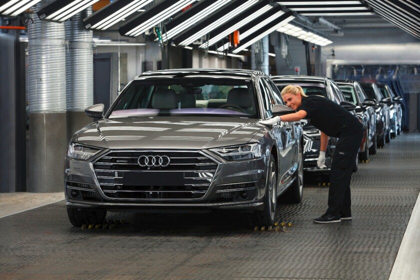 A grey Audi A8 rolls off the production line