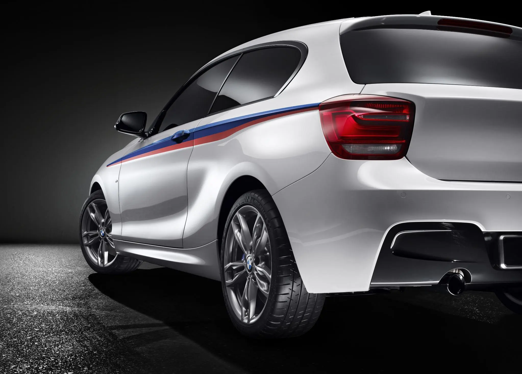 Rear design emphasizes the M135i's flaring wheel arches