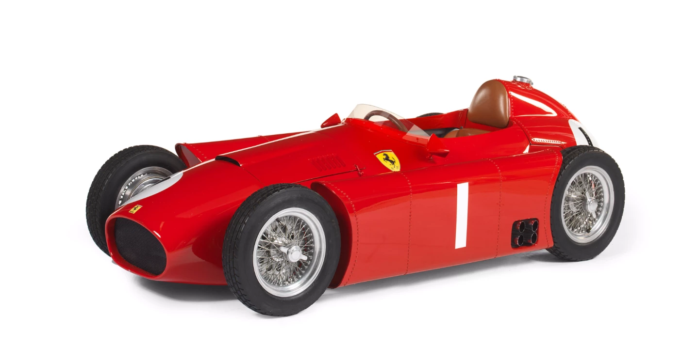 A remarkable, electric-powered, handmade Ferrari Lancia D-50 child's car in half scale. Auction description