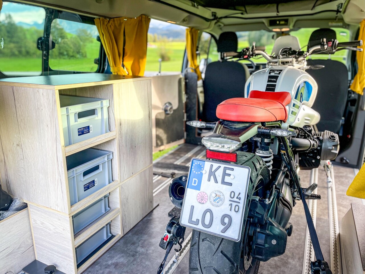 Getting creative with a biking/camping trip for two — a couple seated at the front of the van or on the bike and sleeping in the pop-up roof