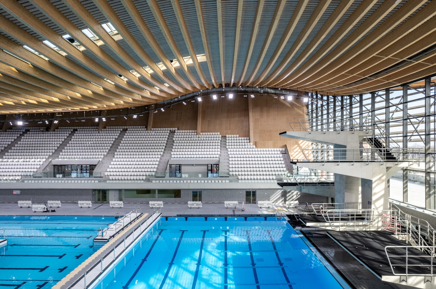 The Aquatics Centre Paris 2024's concave roof was chosen to reduce the level of air-conditioning required