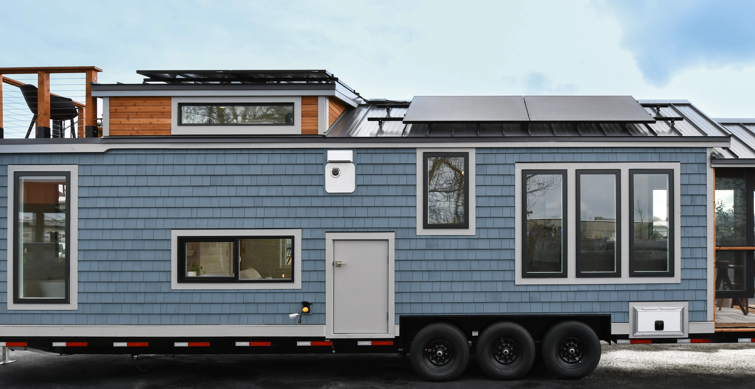 The Cascade Mini, by TruForm Tiny, gets power from a RV-style grid-based hookup or solar panels, which are installed on the roof