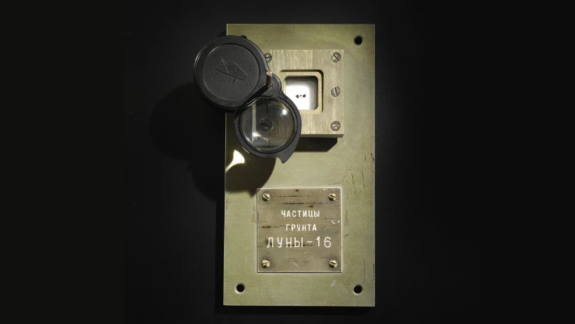 Three small Moon rocks returned by the Soviet Luna 16 mission have been sold at Sotheby's for $855,000