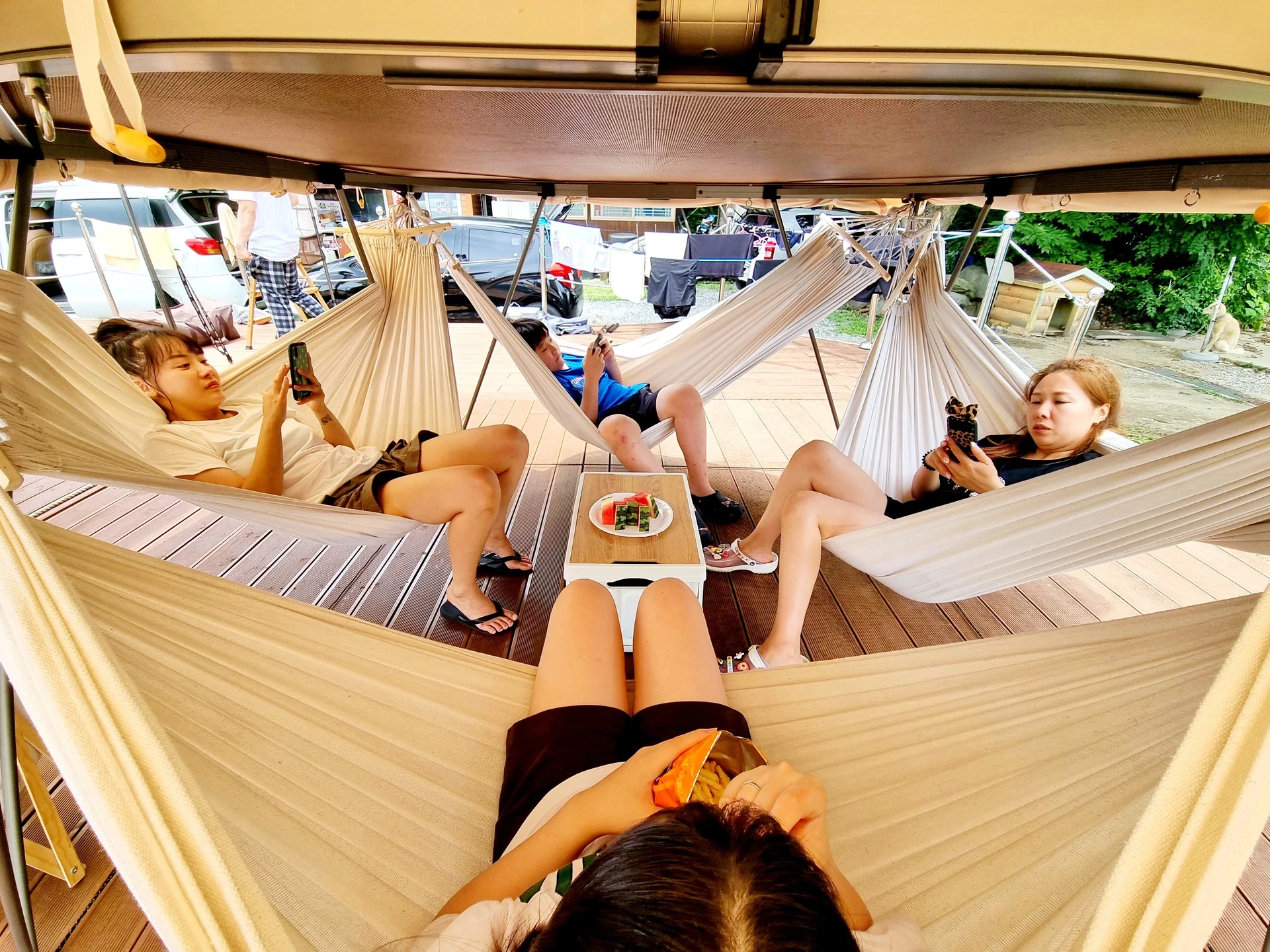 Attach up to four hammocks below The Dookan floor for a shady lounge area