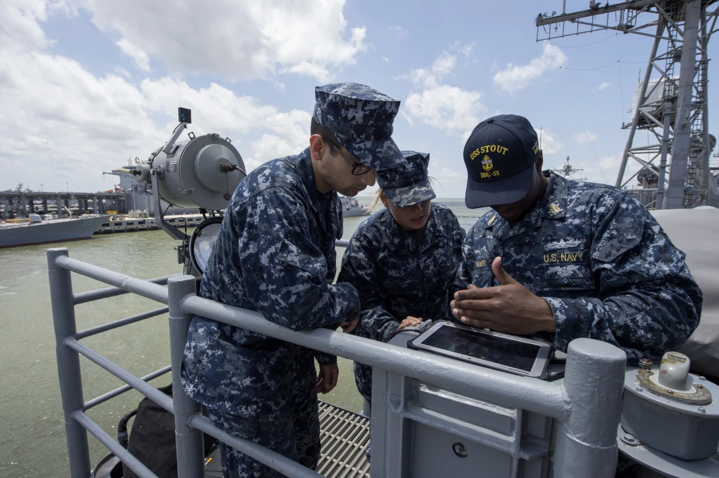 Chief Quartermaster Gregory Flowers from the guided-missile destroyer USS Stout (DDG 55) types a message during a demonstration of the Flashing Light to Text Converter (FLTC)