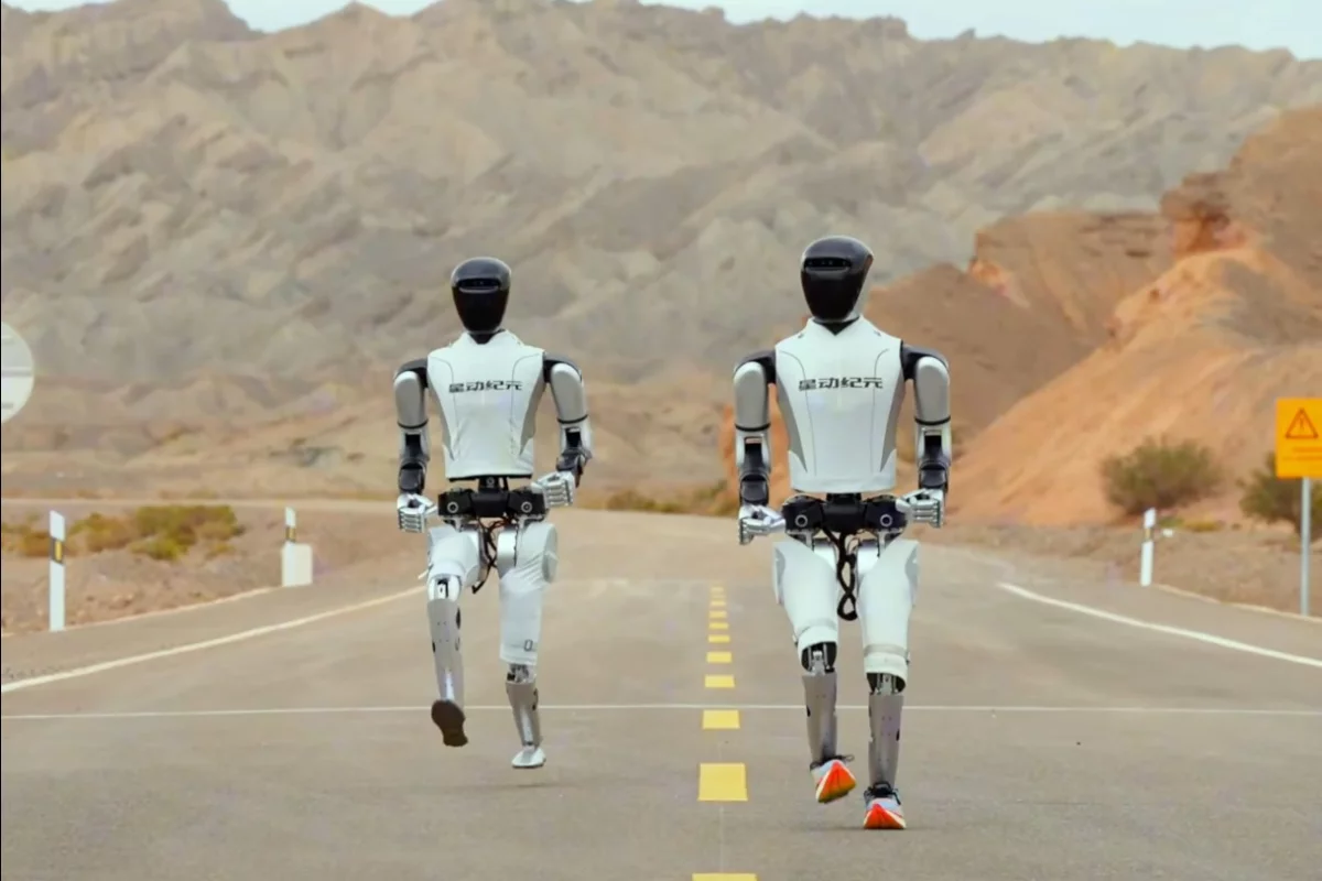 Robot Era's flagship Star1 humanoids cross trail, grassland and road for a Gobi Desert run that tests barefoot against sneaker