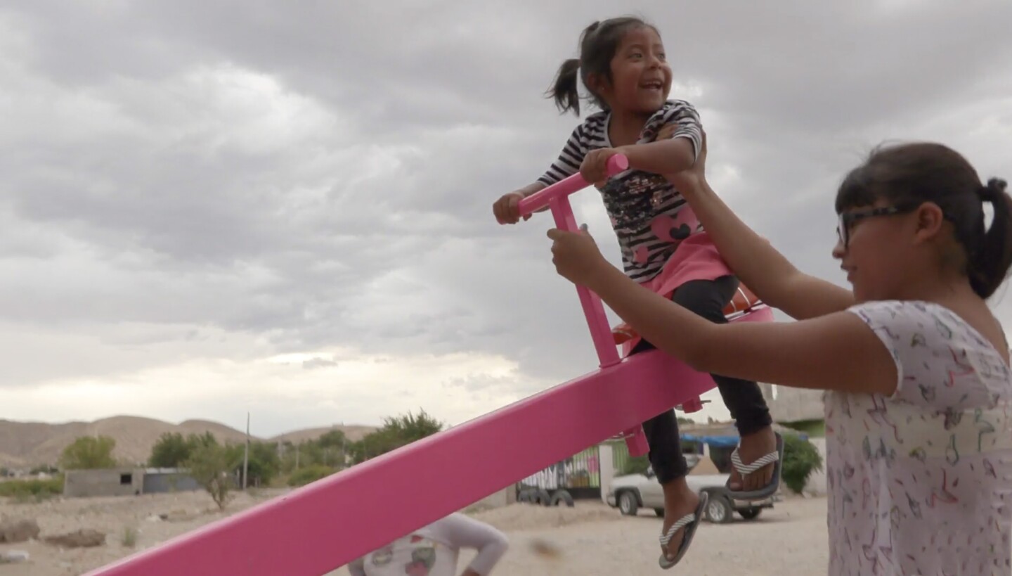Teeter-Totter Wall was only installed for 20 minutes, which was just enough time for some Mexican and American kids to play together