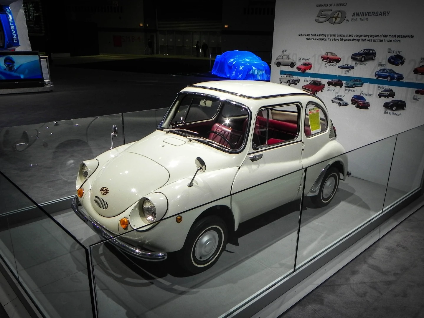 The 1968 Subaru 360, the company's first production vehicle, is on display at the Subaru booth in Chicago as the company celebrates 50 years
