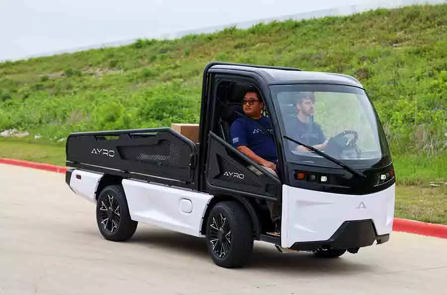 The cabin has seating for two, features a 7-inch display/instrument cluster, a Bluetooth sound system with Android Auto and Apple CarPlay, a rear-view camera feed and a heater