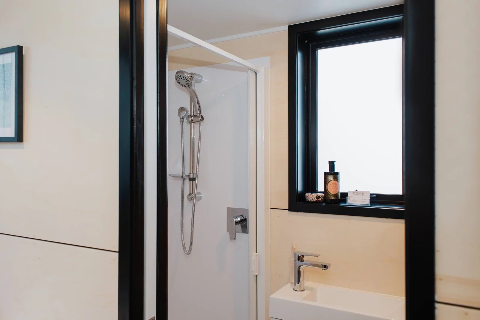 La Sombra Tiny House includes a shower, sink and composting toilet