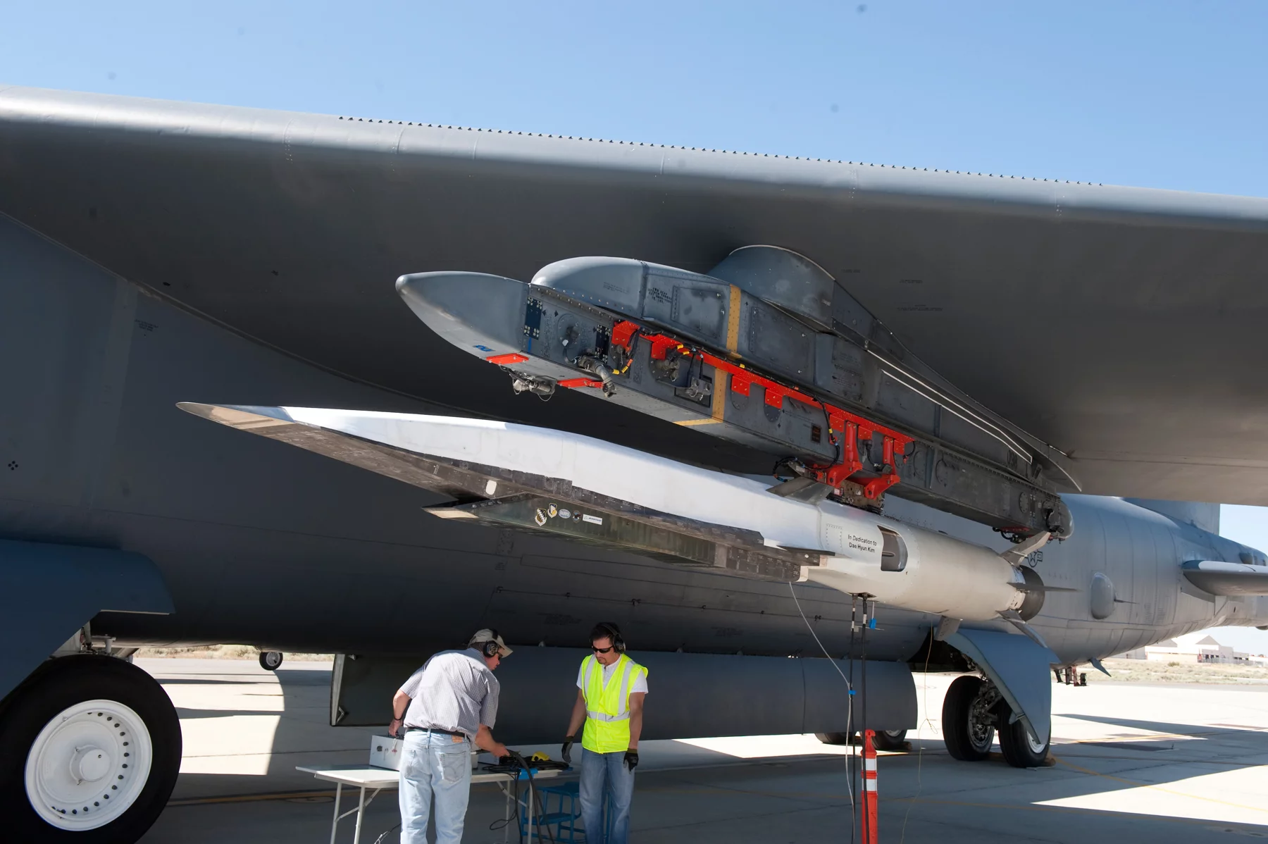 Final checks to the X-51A Waverider scramjet, which is affixed to an Edwards B-52H Stratofortress (Image: Boeing)