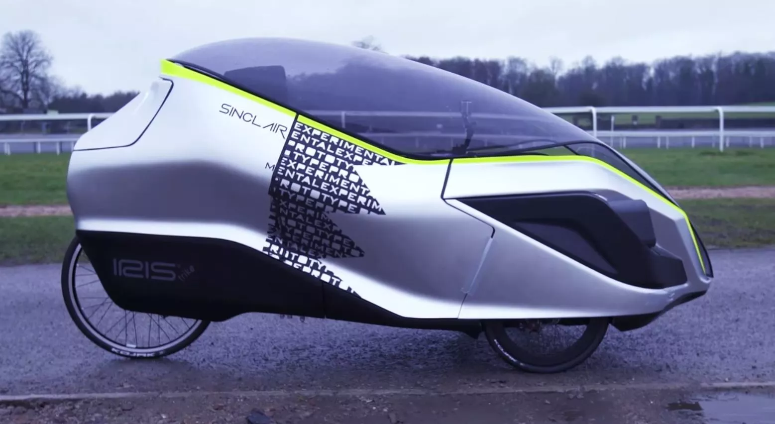 The Iris eTrike is an electric hybrid recumbent tricycle with a plastic canopy