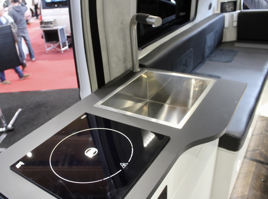 We like the clean lines and angles of Camp-Line's design, right down to the induction cooktop and stainless steel sink
