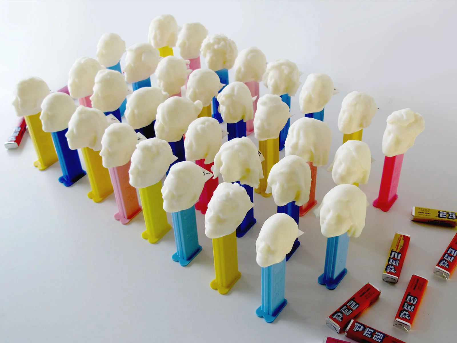 After creating the 3D models, it was just a matter of printing all 32 heads out with a Makerbot Replicator and attaching them to decapitated Pez dispensers