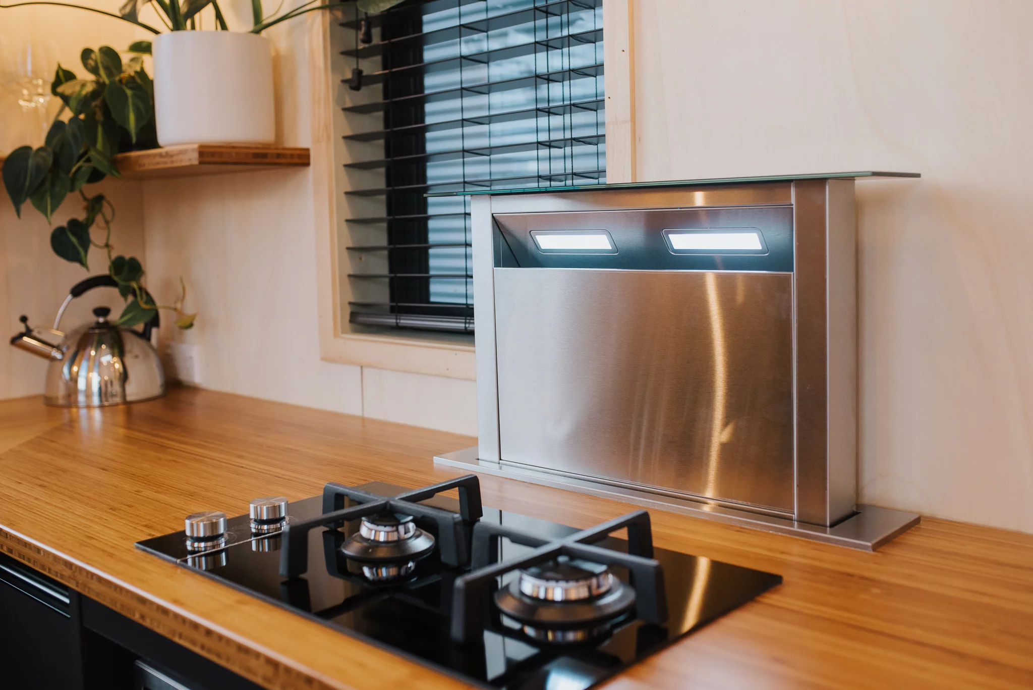 The Autumn's kitchen has a neat range hood that disappears into the cabinetry when not in use