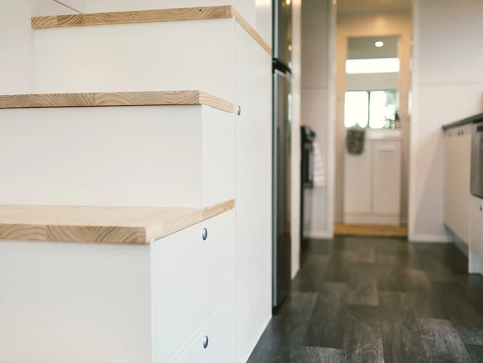 Closeup shot of the Buster Tiny House's storage-integrated staircase