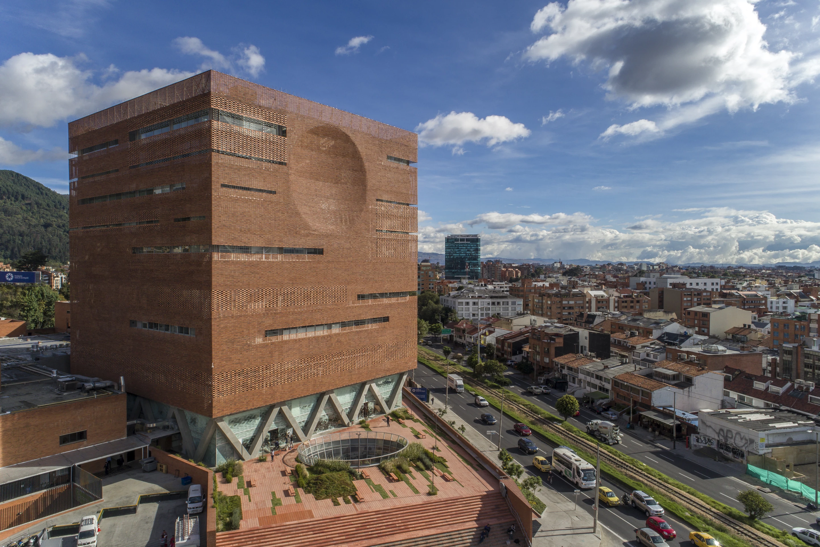 Expansion of the University Hospital of the Santa Fe de Bogotá Foundation, by El Equipo Mazzanti/Giancarlo Mazzanti, is located in Colombia. It consists of a beautiful brick building that contains a tropical garden inside, helping patients relax in comfort as they recover