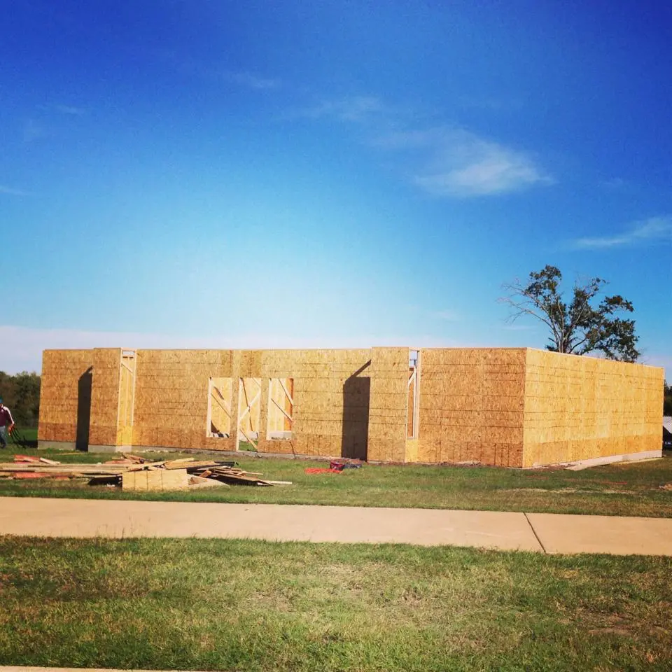 The edible house required a building permit to go up and was built with traditional techniques, which include a solid foundation, wooden framing, and trusses