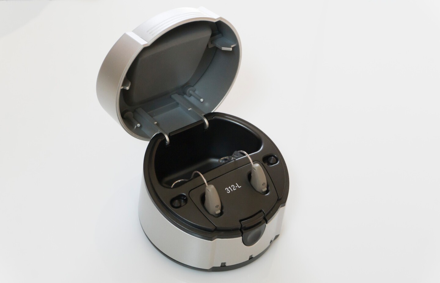 Hearing aids inside charging dock
