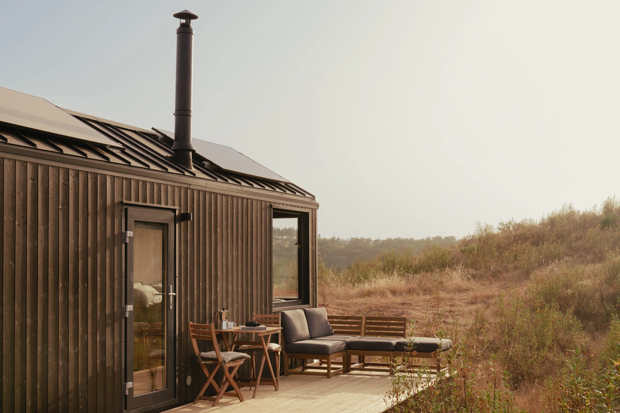 The tiny house has an optional deck area that expands living space significantly