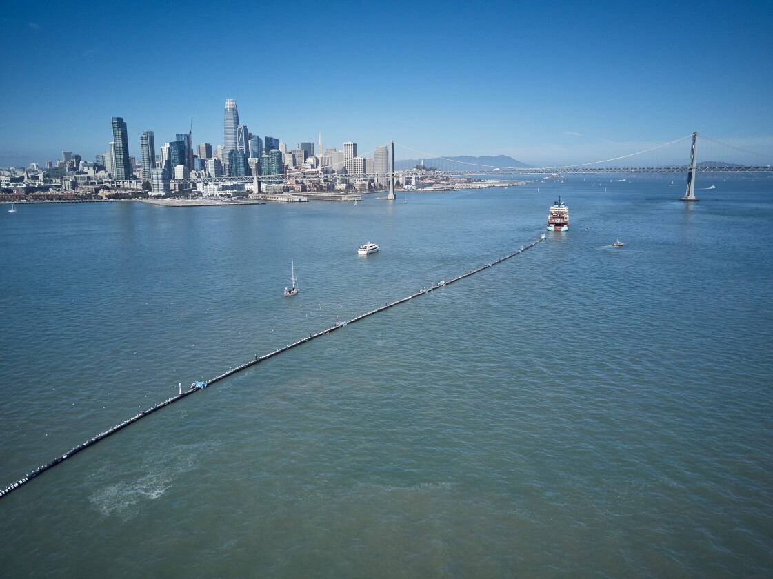 The Ocean Cleanup system is towed out toward the great Pacific Garbage Patch