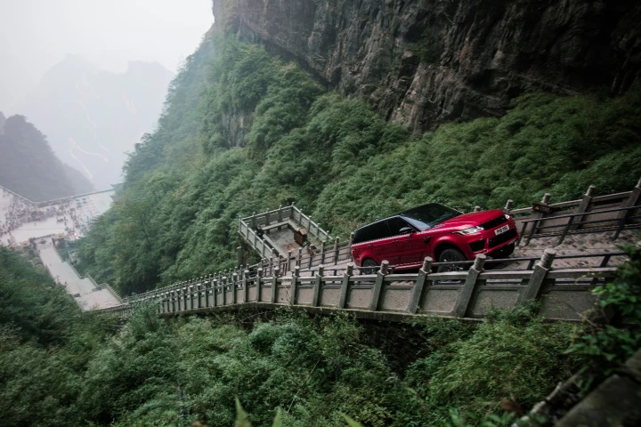 In a stunt unlikely to be repeated, Ho-Pin Tung drives a range rover up the staircase to Heaven's Gate