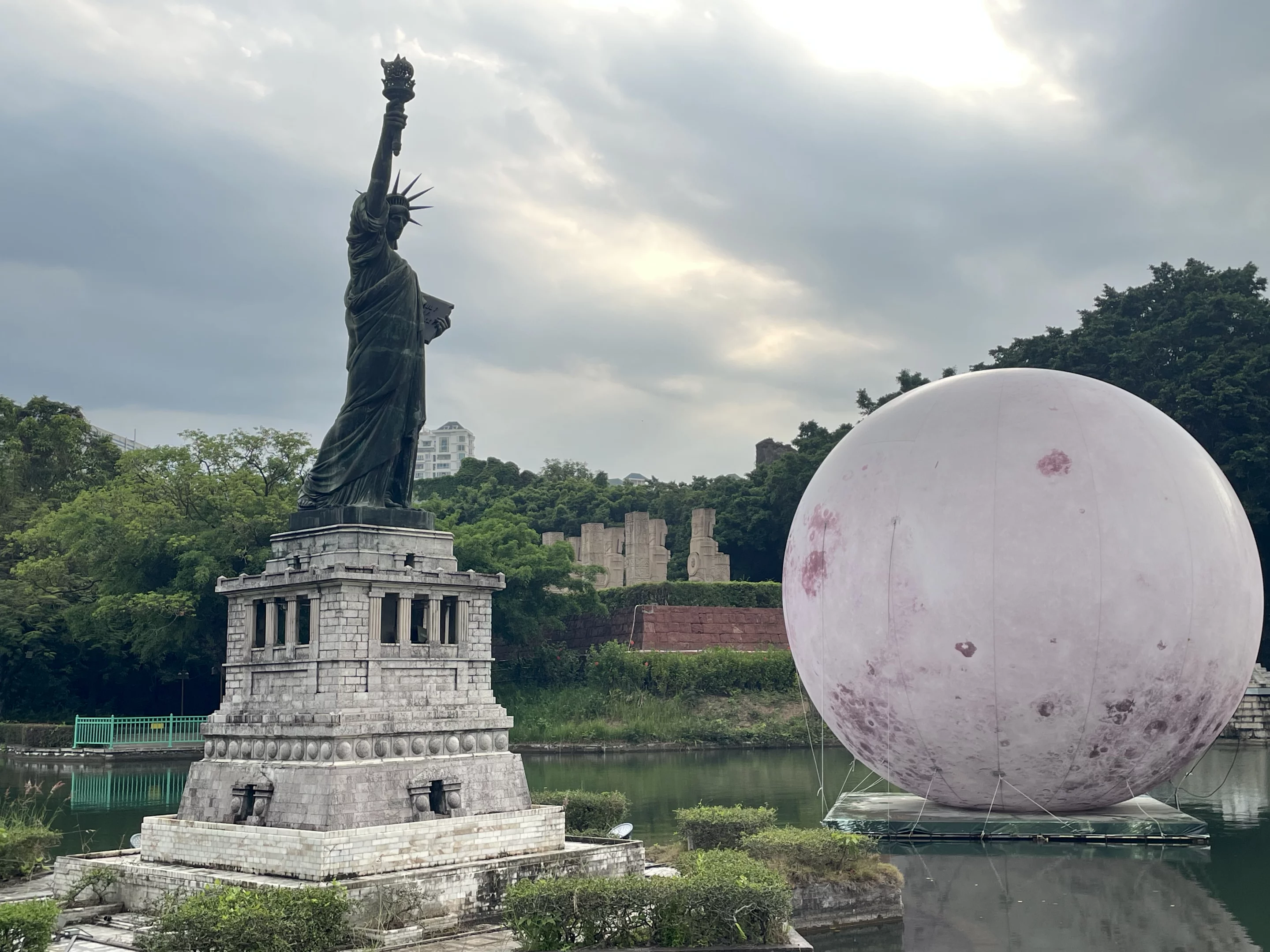The Statue of Liberty and one of the many installations that make more sense when viewed after the sun goes down
