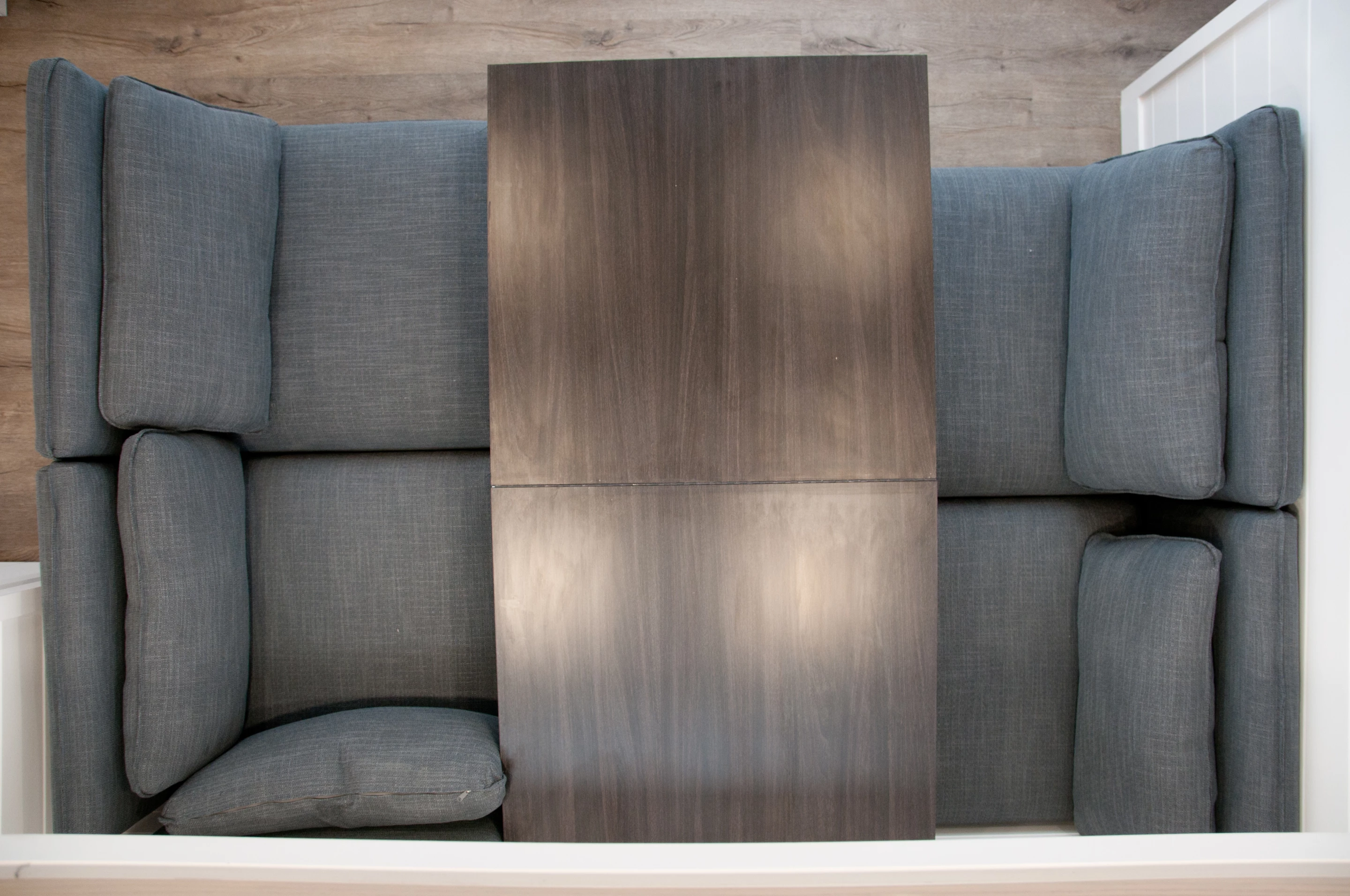 The Charme's living room seats can be rearranged and the table extended