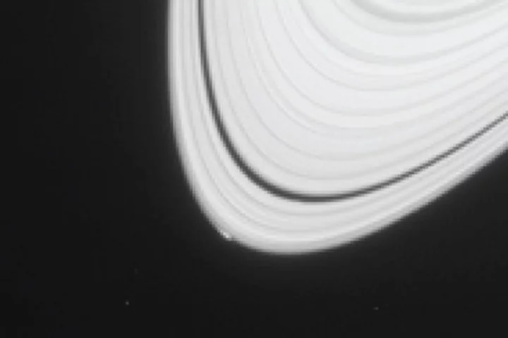 Image of the telltale arc that led scientists to hypothesize the existence of the new moon (Photo: NASA/JPL-Caltech/Space Science Institute)