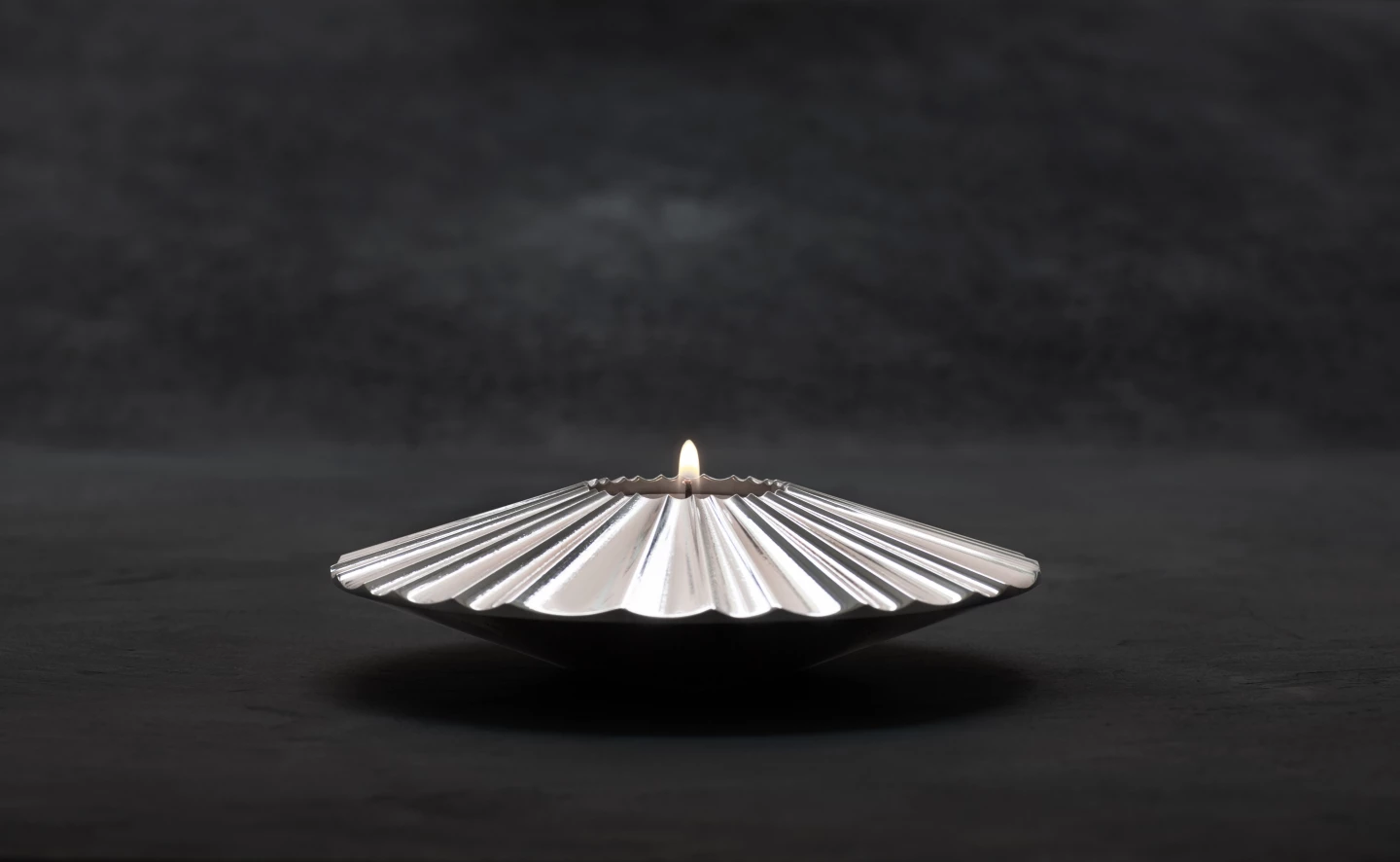 Artist Lena Bergstrom produced the first object from SSAB's batch of fossil-free steel: this candle holder, "symbolizing light at the end of the tunnel."