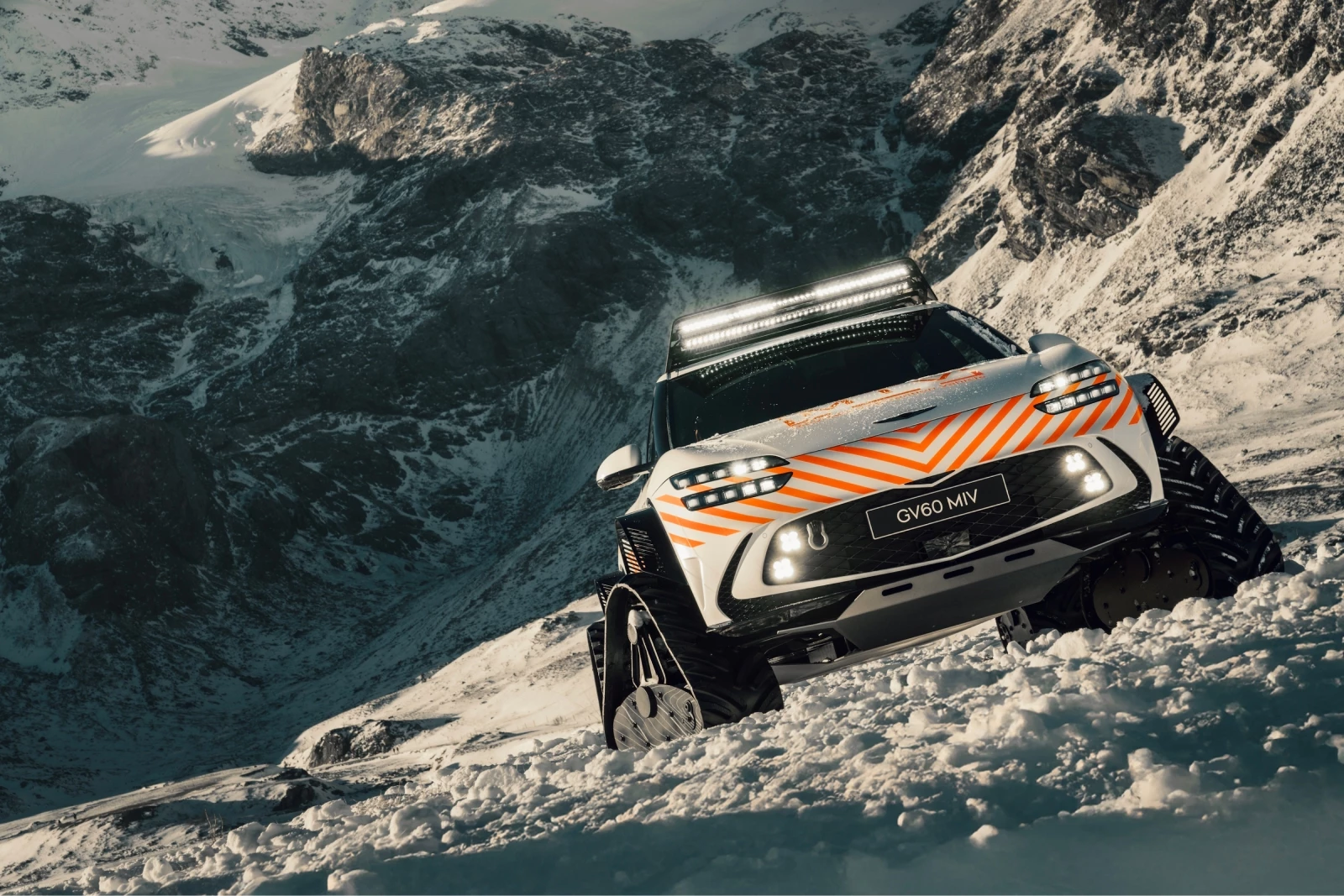 The Genesis GV60 MIV Concept sports tank-like snow tracks and carbon fiber wheel arc extensions
