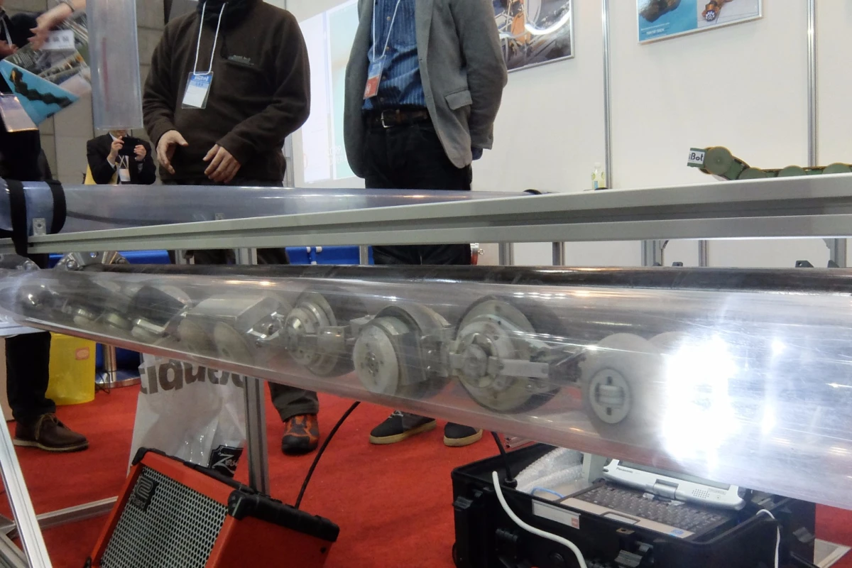 THESBOT moves through a clear acrylic pipe at IREX 2015