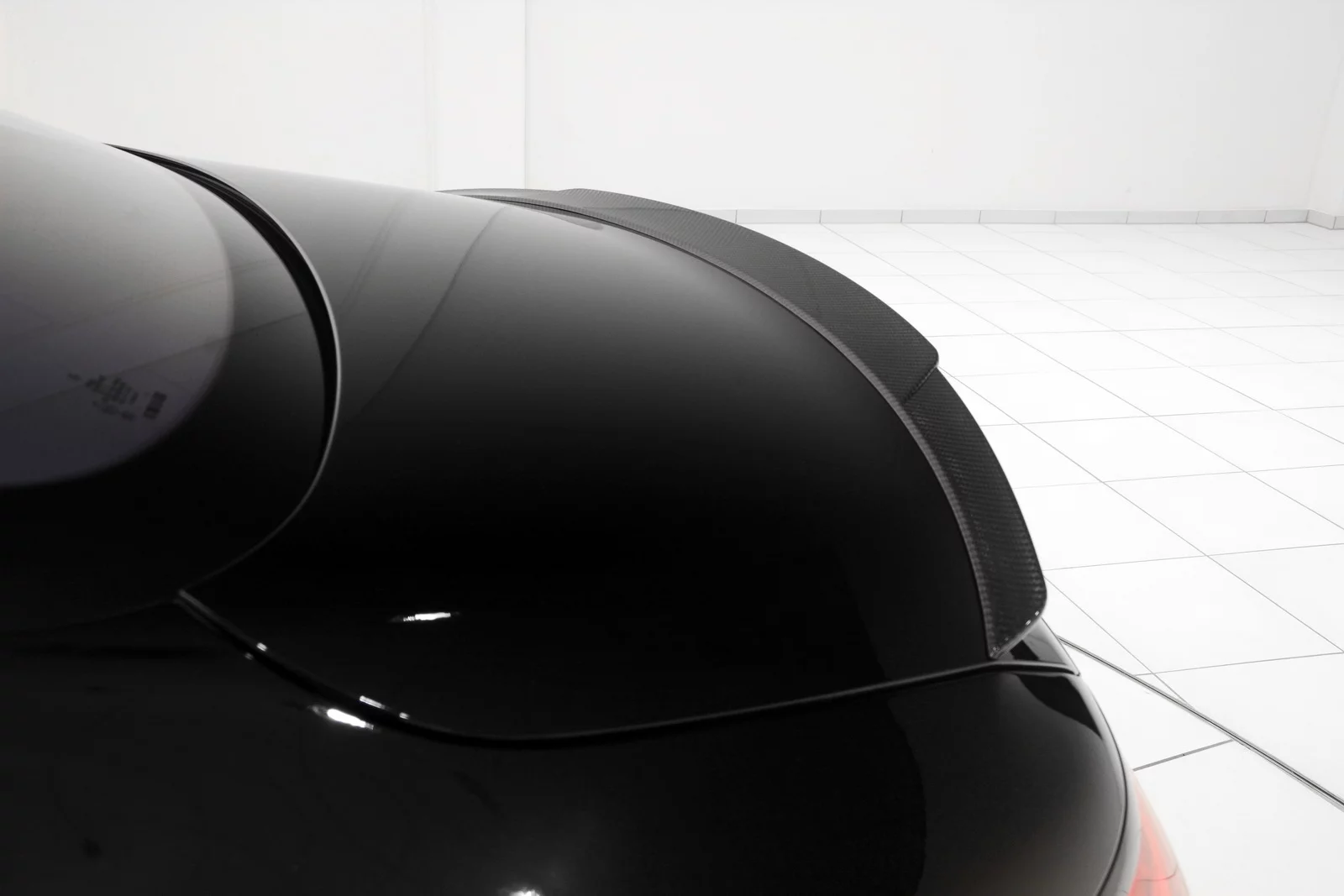 Like other aero components, the subtle rear spoiler is made from carbon fiber