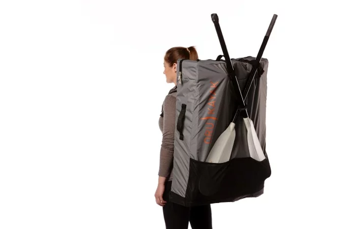The Oru Bay+ with split paddle and backpack (both sold separately) ready to hike to the water