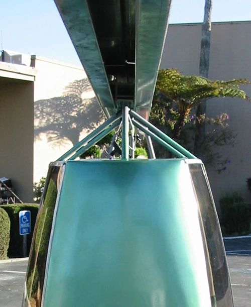 The JPod is suspended beneath an overhead rail structure, which would be topped with photovoltaic panels