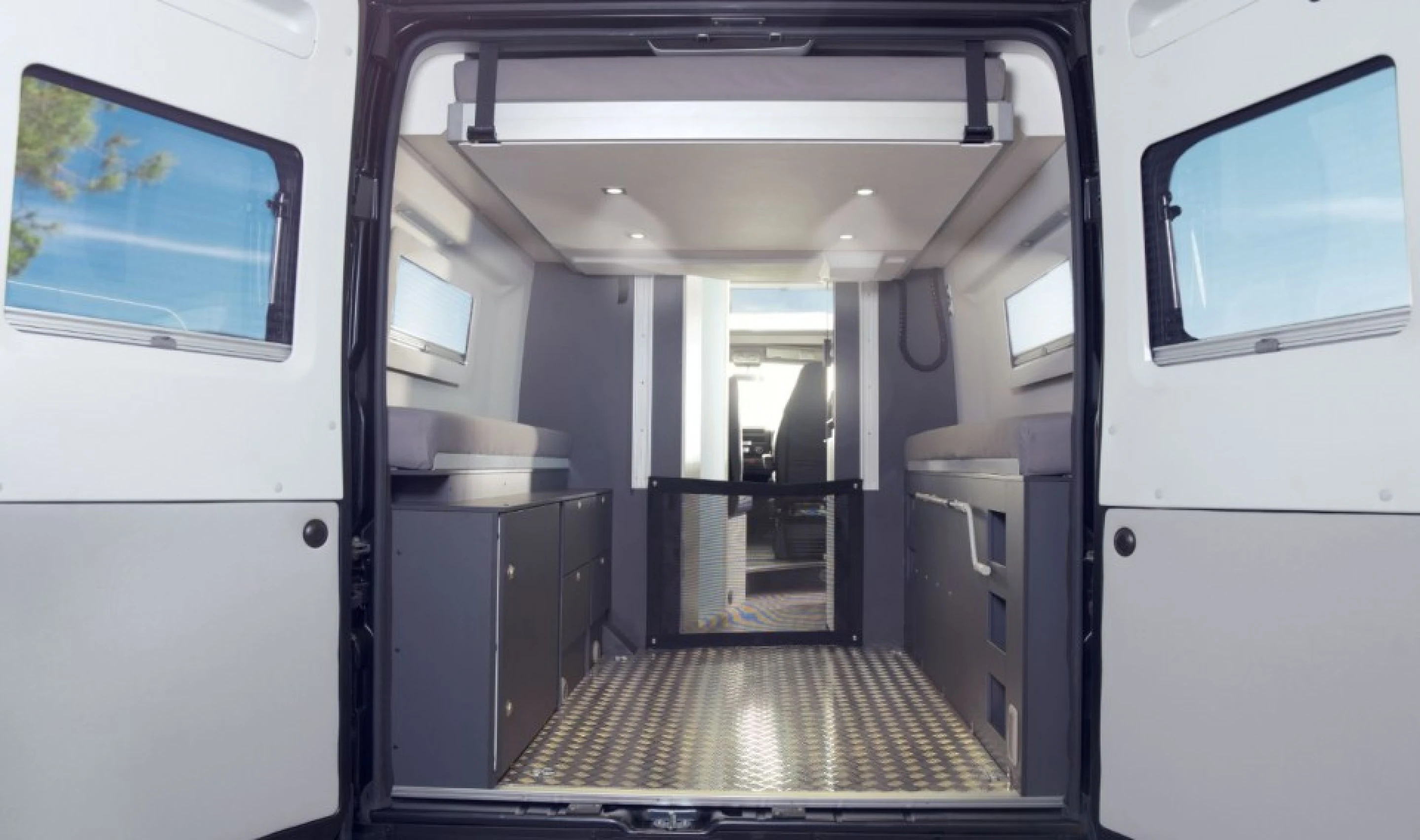 Camper van answers adventure's call with flex bed-garage and panoramic roof