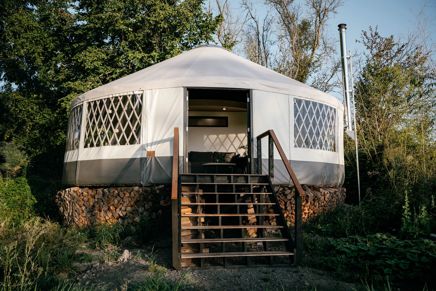 Utilizing a traditional yurt structure, the home measures just over 30 ft (9.14 m) in diameter