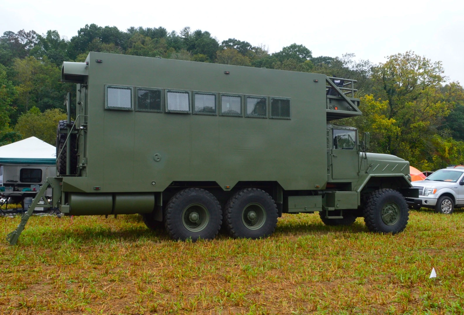 The massive Bravo 1 expedition truck is an owner-converted 5-ton BMW military truck with serious style