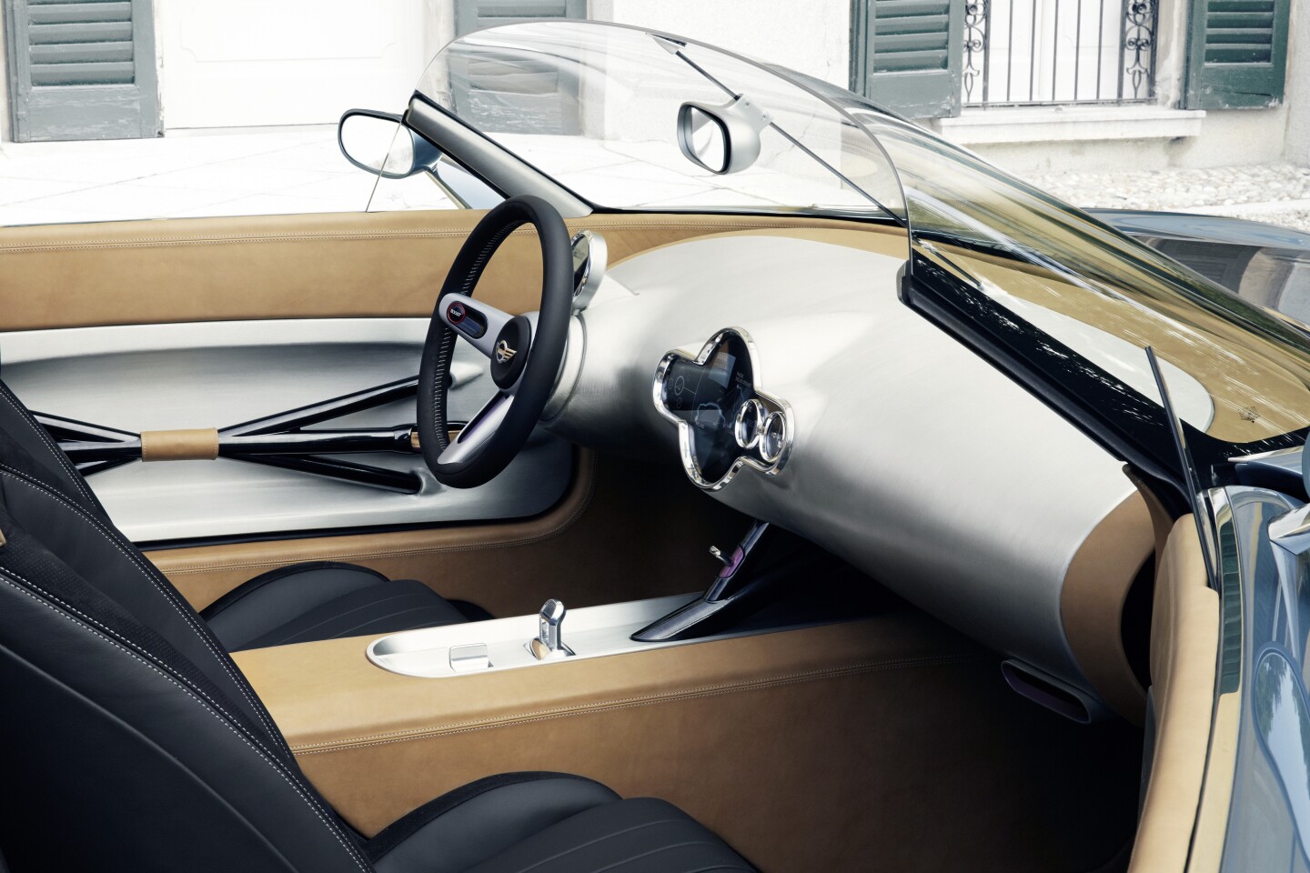 The bare center console is again an exercise in minimalism, playing off the unfinished look of the matte aluminum dashboard