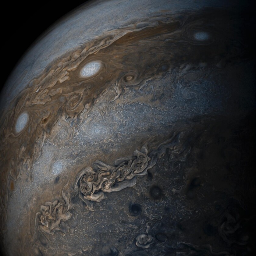 Jupiter's famous bands of color extend 3,000 km below the surface