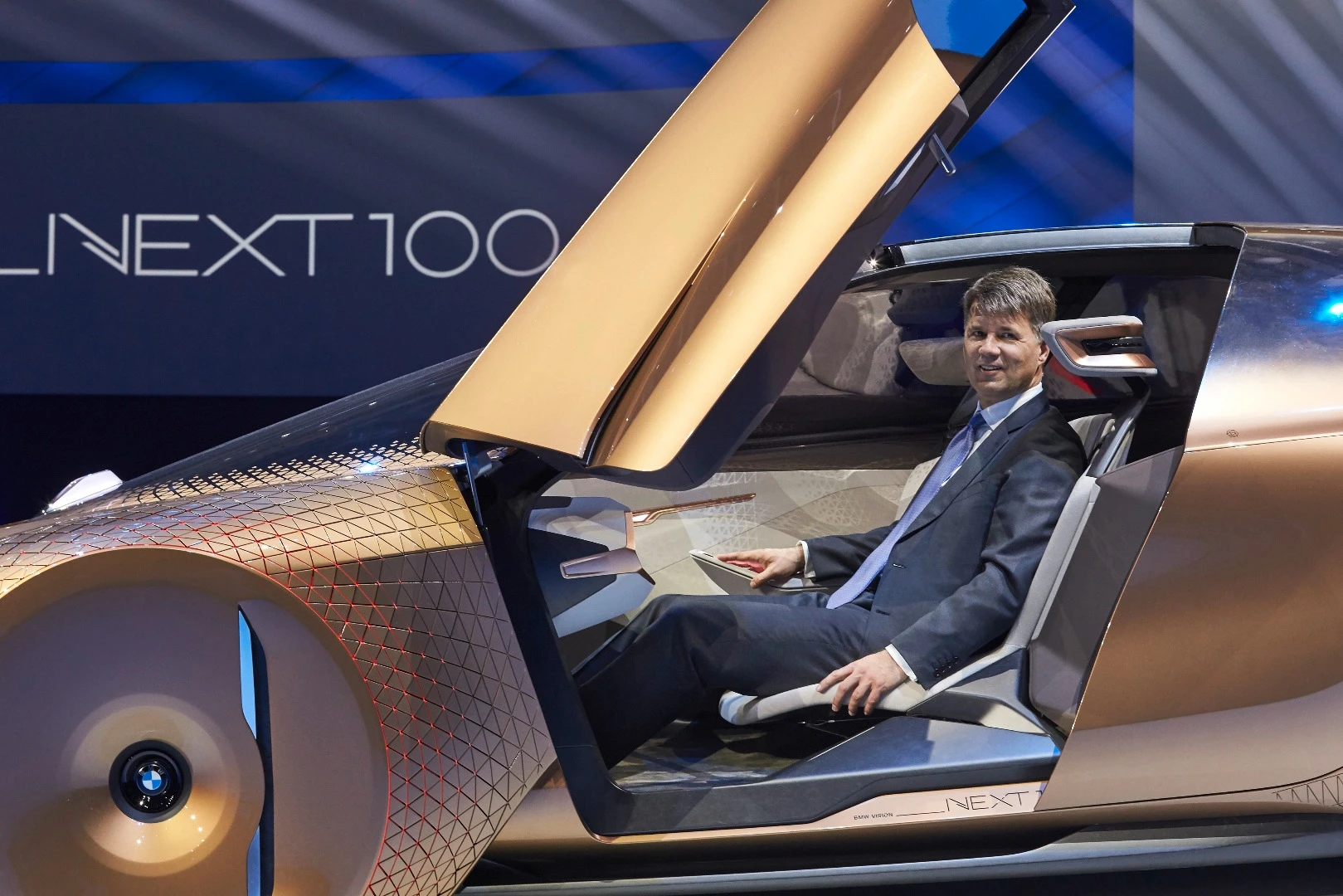 The BMW Vision Next 100 concept has automatic scissor wing doors and a retractable steering column