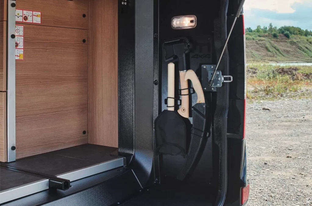 The Performance 4x4 includes a tool kit with saw, hatchet and folding space