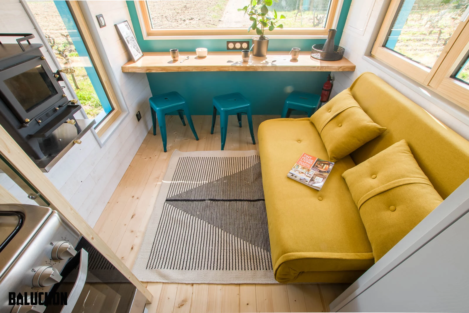 Tiny House Sïana's living room contains a small wood-burning stove, which should be sufficient to heat the compact home