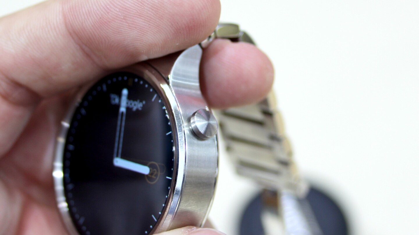 The watch has a crown button at the two o'clock position