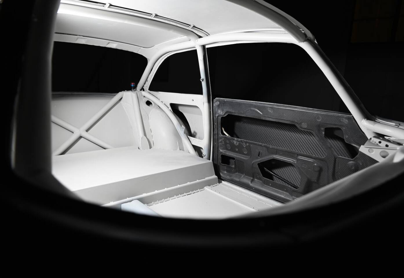 The roll cage follows the original contours of the car to add strength without changing the classic look
